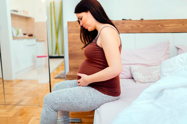 Боль в яичниках в период беременности